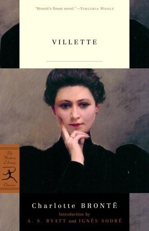 The cover of Villette by Charlotte Bronte. It features a painting of a lady with black hair in an updo wearing a black dress from the chest up. She is looking at the viewer and holding one hand to her chin and cheek.